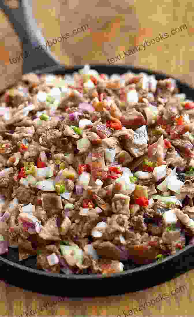 An Enticing Image Of Sisig, A Filipino Pork Dish Served On A Sizzling Platter Pulutan Filipino Bar Bites Appetizers And Street Eats: (Filipino Cookbook With Over 60 Easy To Make Recipes)